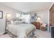 Comfortable bedroom with decor and a 'Changes in Attitude' pillow on the bed at 10518 Greenway Dr, Fishers, IN 46037