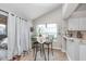 Breakfast nook with tile floors and plenty of natural light from the sliding glass doors at 10518 Greenway Dr, Fishers, IN 46037