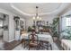 Inviting dining room features stylish decor, tray ceiling, and lots of natural light at 10518 Greenway Dr, Fishers, IN 46037