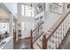 Grand foyer with high ceilings, beautiful staircase, and abundant natural light at 10518 Greenway Dr, Fishers, IN 46037
