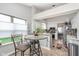 Bright eat-in kitchen with stainless appliances, tile floors, and charming breakfast nook area at 10518 Greenway Dr, Fishers, IN 46037