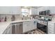 Charming kitchen featuring stainless steel appliances, and bright cabinetry at 10518 Greenway Dr, Fishers, IN 46037