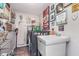 Well decorated laundry room with washer, dryer, utility sink, and plenty of storage at 10518 Greenway Dr, Fishers, IN 46037