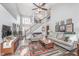 Spacious living room with high ceilings, comfortable sofas, and a view of the foyer at 10518 Greenway Dr, Fishers, IN 46037