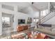 Open-concept living space featuring comfortable seating, a TV, and access to the kitchen at 10518 Greenway Dr, Fishers, IN 46037
