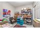 Organized storage room featuring ample shelving, wooden chest, and rolling utility cart for maximum storage solutions at 10518 Greenway Dr, Fishers, IN 46037