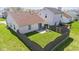 Aerial view of a fenced backyard, patio and home at 10876 Bellflower Ct, Indianapolis, IN 46235