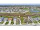Aerial view of a single-Gathering home in a suburban neighborhood with pond in the distance at 10876 Bellflower Ct, Indianapolis, IN 46235