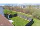 Aerial view of a backyard with a dark stained wooden fence and lush green grass at 10876 Bellflower Ct, Indianapolis, IN 46235