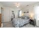 Inviting bedroom featuring neutral decor, a comfortable bed, and ample natural light at 10876 Bellflower Ct, Indianapolis, IN 46235