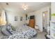 Spacious bedroom with cozy carpet, a ceiling fan, and easy access to the en-suite bathroom at 10876 Bellflower Ct, Indianapolis, IN 46235