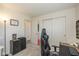 Bedroom with carpet, double closets, and an open door to another room at 10876 Bellflower Ct, Indianapolis, IN 46235