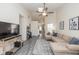 Open-concept living room with vaulted ceilings, modern decor, and lots of natural light at 10876 Bellflower Ct, Indianapolis, IN 46235