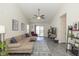 Bright living room with high ceilings, cozy sectional sofa, and modern flooring at 10876 Bellflower Ct, Indianapolis, IN 46235