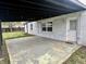 Back patio with painted brick exterior, leading to a fenced yard at 122 Southlane Dr, New Whiteland, IN 46184