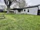 A spacious backyard featuring a covered patio, ideal for outdoor relaxation and entertainment at 122 Southlane Dr, New Whiteland, IN 46184