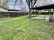 Backyard featuring a covered patio and a newly stained fence offering privacy and charm at 122 Southlane Dr, New Whiteland, IN 46184