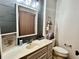 Bathroom features modern mirror, gray shiplap wall, and neutral color palette at 122 Southlane Dr, New Whiteland, IN 46184