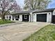 Charming brick home with a well-manicured lawn and attached garage at 122 Southlane Dr, New Whiteland, IN 46184