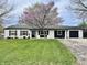 Charming one-story home with a well-maintained lawn and fresh, white-painted brick at 122 Southlane Dr, New Whiteland, IN 46184
