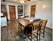 Large room with hardwood flooring, perfect for a game room, with two entrances and a ceiling fan at 122 Southlane Dr, New Whiteland, IN 46184