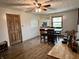 Corner room with hardwood flooring, a window, perfect for a game room, with an entryway at 122 Southlane Dr, New Whiteland, IN 46184