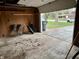 A garage interior showing golf clubs and lawn care items at 122 Southlane Dr, New Whiteland, IN 46184
