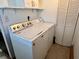 Bright laundry room featuring a side-by-side washer and dryer at 122 Southlane Dr, New Whiteland, IN 46184