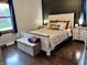 This is a view of a bedroom with a queen bed and matching bedside tables at 122 Southlane Dr, New Whiteland, IN 46184