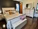 Relaxing main bedroom with a large bed, dresser, and ample natural light at 122 Southlane Dr, New Whiteland, IN 46184