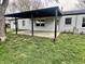 A covered patio provides the perfect outdoor extension for relaxation and social gatherings at 122 Southlane Dr, New Whiteland, IN 46184