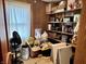 A cluttered storage room with shelving, boxes, and miscellaneous items at 122 Southlane Dr, New Whiteland, IN 46184