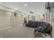 Finished basement features a comfortable leather sofa, a projector and screen, and recessed lighting at 12223 Split Granite Dr, Fishers, IN 46037