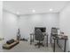 Finished basement home office features a desk, chair, and shelves, creating a functional workspace at 12223 Split Granite Dr, Fishers, IN 46037