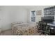 Bedroom with colorful bedspread, neutral walls, and office area at 12223 Split Granite Dr, Fishers, IN 46037
