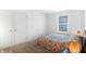 Bedroom with bright spread, neutral walls and carpet, closet, and bright lamp at 12223 Split Granite Dr, Fishers, IN 46037