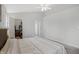 Bedroom with neutral colored walls and carpet with closet and en-suite bathroom entrances at 12223 Split Granite Dr, Fishers, IN 46037