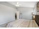 Bedroom with neutral colored walls and carpet, a ceiling fan, and multiple mirrors at 12223 Split Granite Dr, Fishers, IN 46037