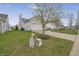View of the back of the home, showing vinyl siding, and a two-car garage, with landscaping at 12223 Split Granite Dr, Fishers, IN 46037