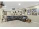 Large living room area featuring recessed lighting, projector, and a big sectional couch with movie posters on the walls at 12223 Split Granite Dr, Fishers, IN 46037