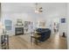 Spacious living room featuring a fireplace, large windows, and hardwood floors at 12223 Split Granite Dr, Fishers, IN 46037