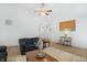 Open living room with vaulted ceilings, ceiling fan, fireplace, and hardwood floors at 12223 Split Granite Dr, Fishers, IN 46037