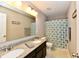 Bathroom featuring double sinks, granite countertops, and a shower with patterned curtain at 1291 Timber Bluff Rd, Westfield, IN 46074