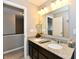 Bathroom with granite countertops, double sinks, and a large mirror at 1291 Timber Bluff Rd, Westfield, IN 46074