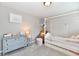 Charming bedroom with a four-poster bed, cozy chair, and a decorative dresser at 1291 Timber Bluff Rd, Westfield, IN 46074