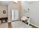 Bright foyer with a soaring ceiling, decorative rug, white bench, and wooden floors at 1291 Timber Bluff Rd, Westfield, IN 46074