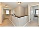 Upstairs hallway features neutral walls and carpet that create a cozy, inviting atmosphere at 1291 Timber Bluff Rd, Westfield, IN 46074