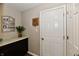 Hallway with granite counter, cabinet, decoration and a white panel door with a knob at 1291 Timber Bluff Rd, Westfield, IN 46074