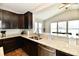 Kitchen features granite countertops, stainless steel appliances, and hardwood flooring with an open view to the living room at 1291 Timber Bluff Rd, Westfield, IN 46074