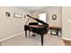 Cozy living room featuring a grand piano, plush carpet, and neutral wall colors at 1291 Timber Bluff Rd, Westfield, IN 46074